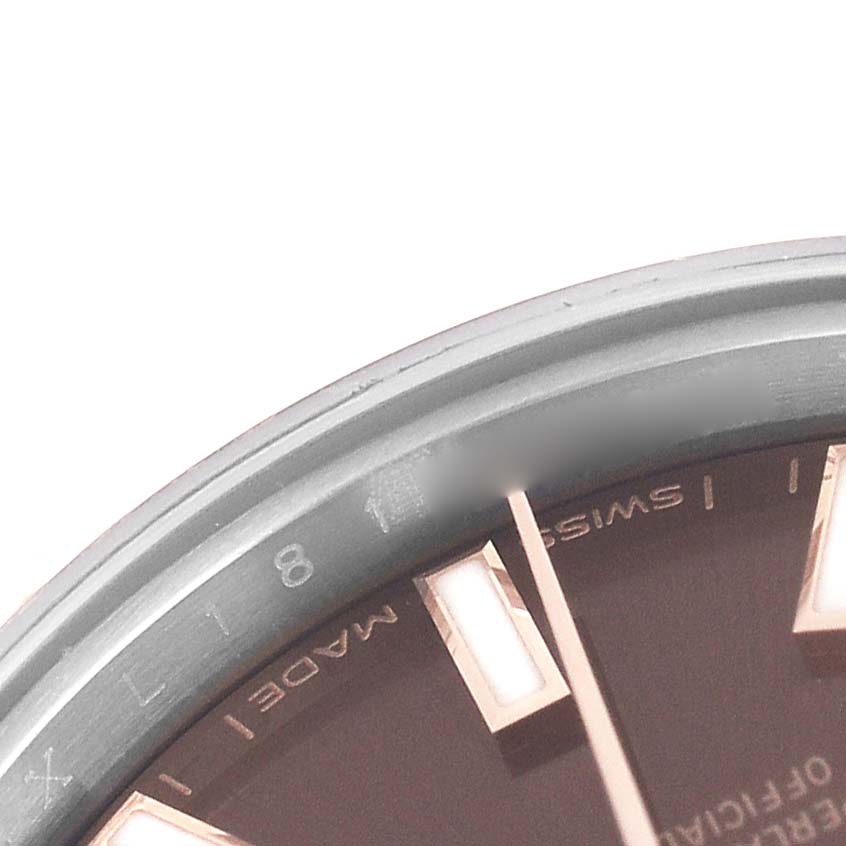 The image shows a partial view of the dial and bezel of a Rolex Datejust 279171 Women's Stainless Steel Brown Dial, emphasizing the indices and text details.