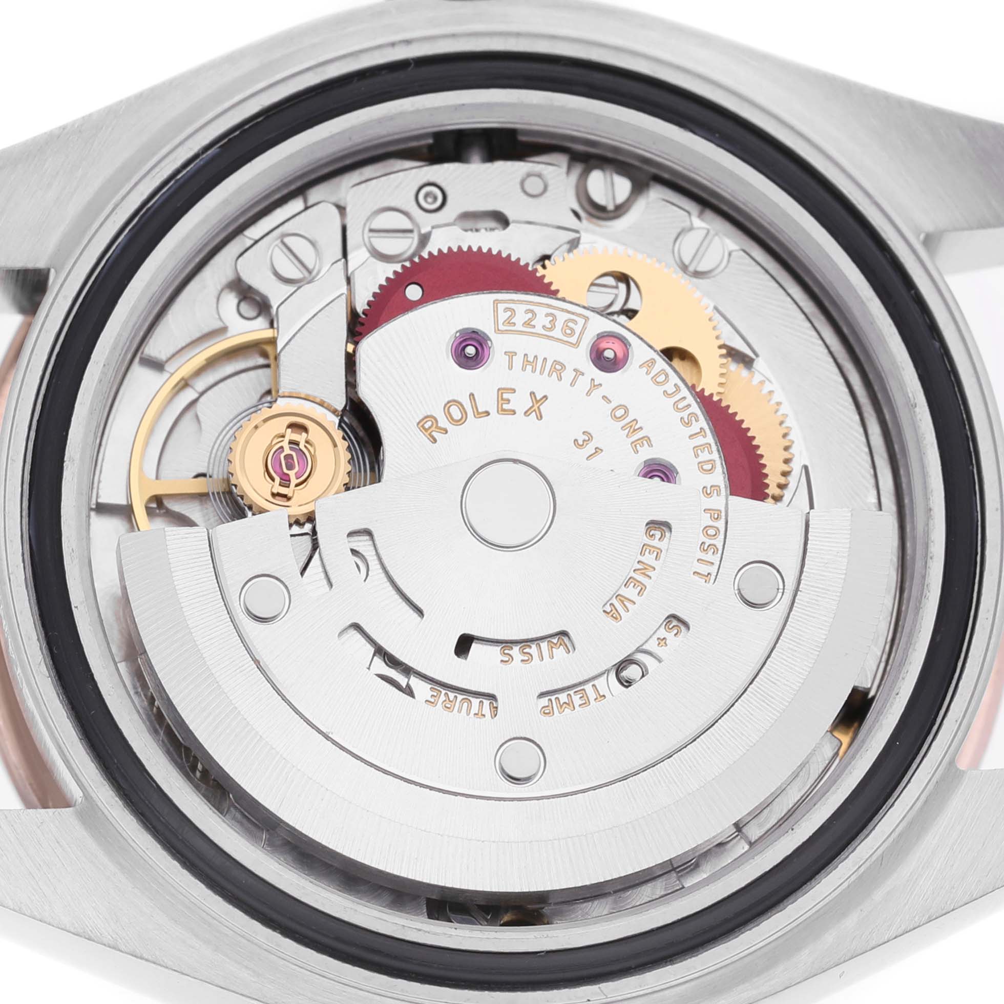 The image shows a close-up of the movement mechanism of a Rolex Datejust 279171 Women's Stainless Steel Brown Dial, displaying gears and intricate parts.