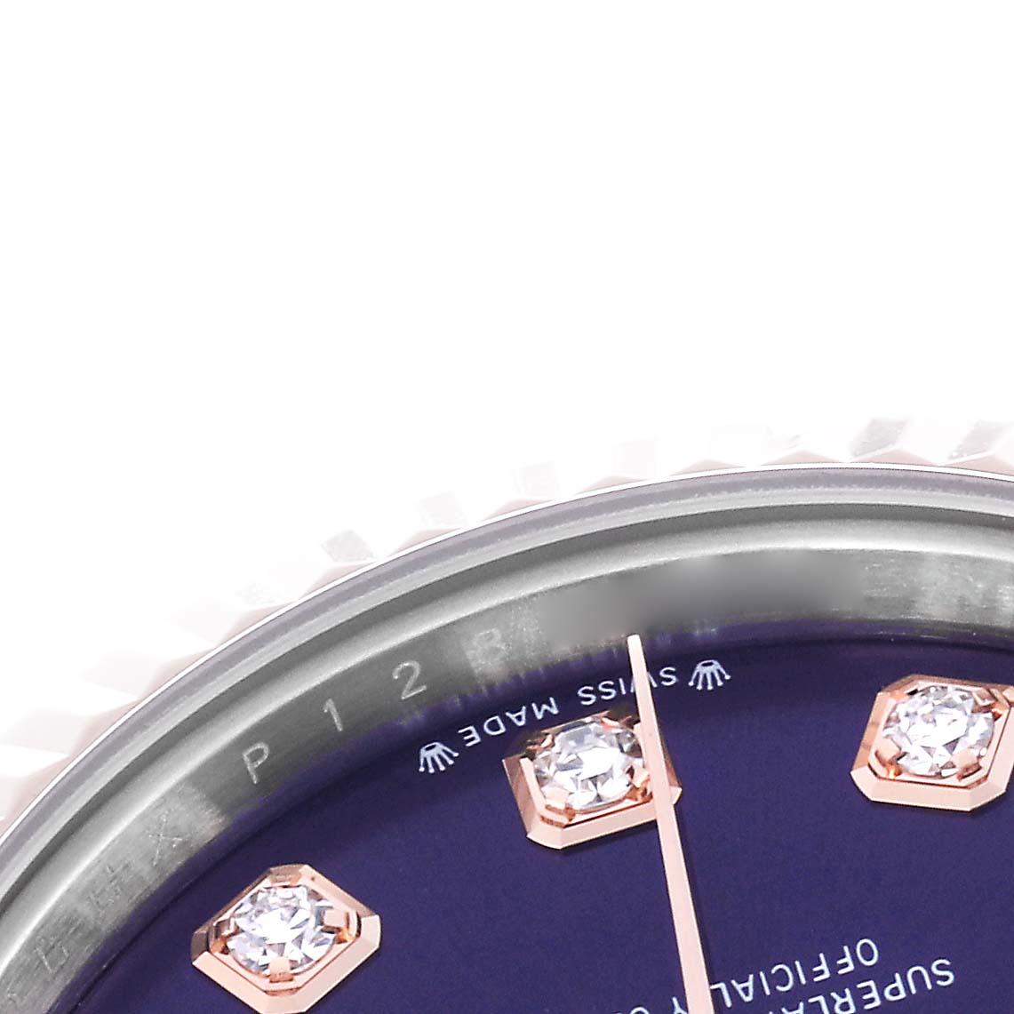 The image shows a close-up of a Rolex Datejust 279171 Women
s Steel and Gold (two tone) Purple Dial 279171 Women
s Steel and Gold (two tone) Purple Dial watch dial with diamond hour markers and part of the fluted bezel.