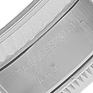 This image shows a close-up of the stainless steel bracelet of a Rolex Datejust 69174 Women's Stainless Steel Silver Dial 69174 Women's Stainless Steel Silver Dial watch, particularly the part with the engraved text.