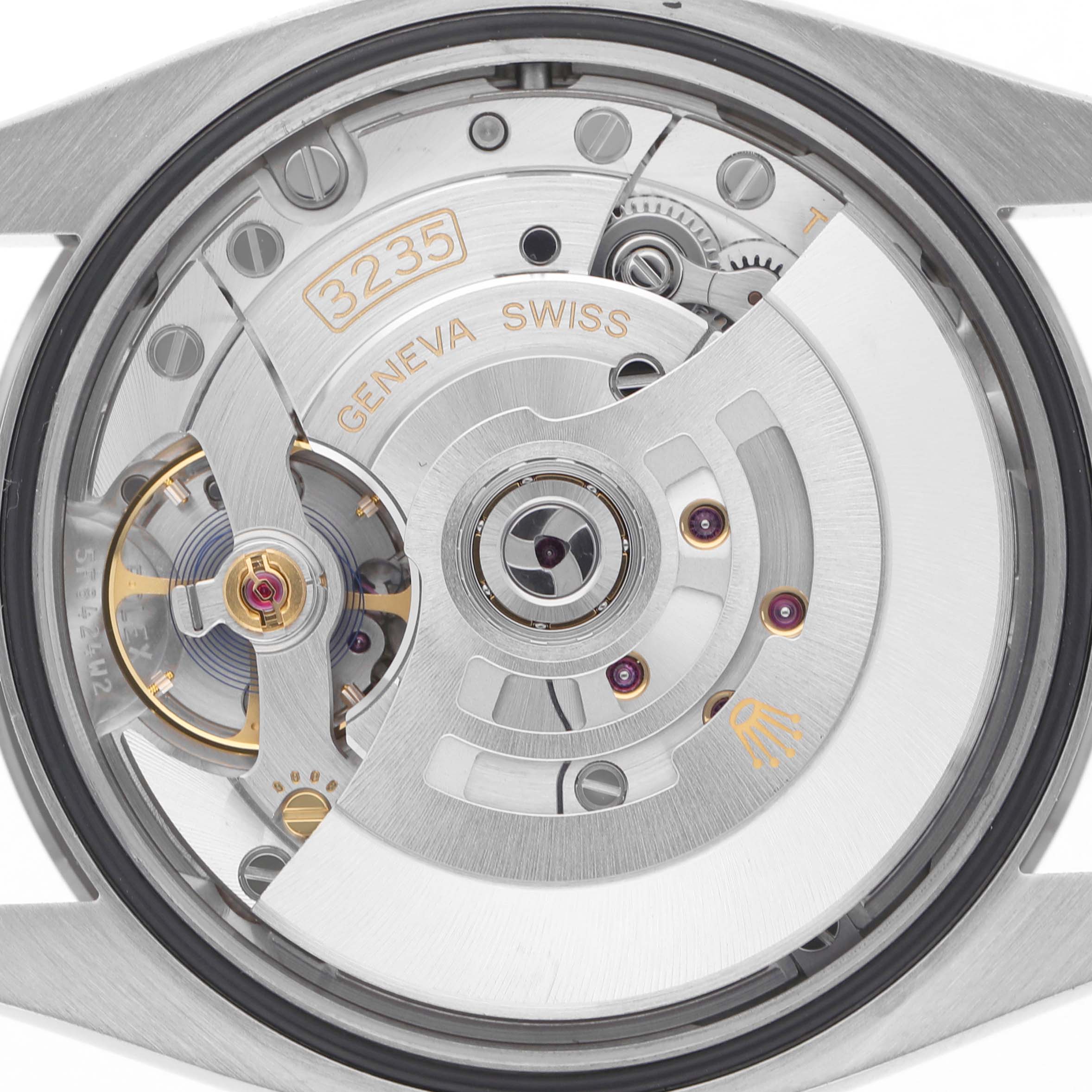 The image shows the movement of a Rolex Datejust 126234 Men's Stainless Steel Mother of Pearl Dial, highlighting the intricate gears and rotor from a back view.