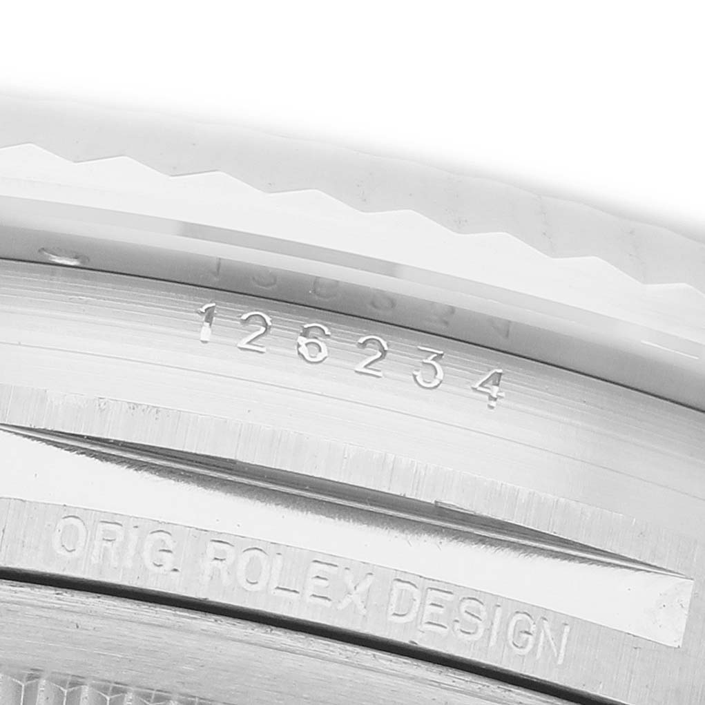 The image shows a close-up of the side engraving on the case of a Rolex Datejust 126234 Men's Stainless Steel Mother of Pearl Dial watch.