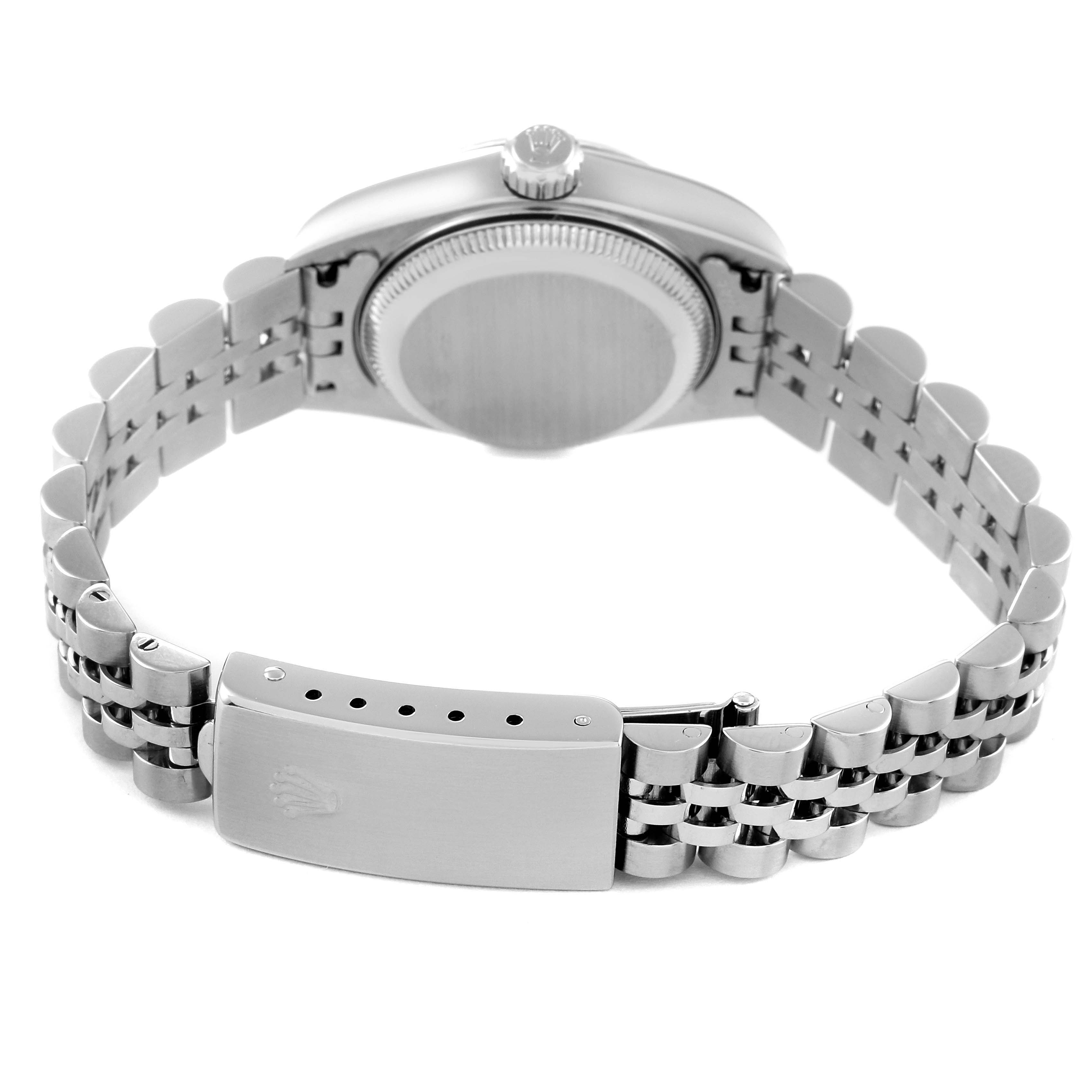 The image shows the back view of a Rolex Datejust 79174 Women's Stainless Steel Mother of Pearl Dial 79174 Women's Stainless Steel Mother of Pearl Dial watch, focusing on the case back and clasp of the metal bracelet.