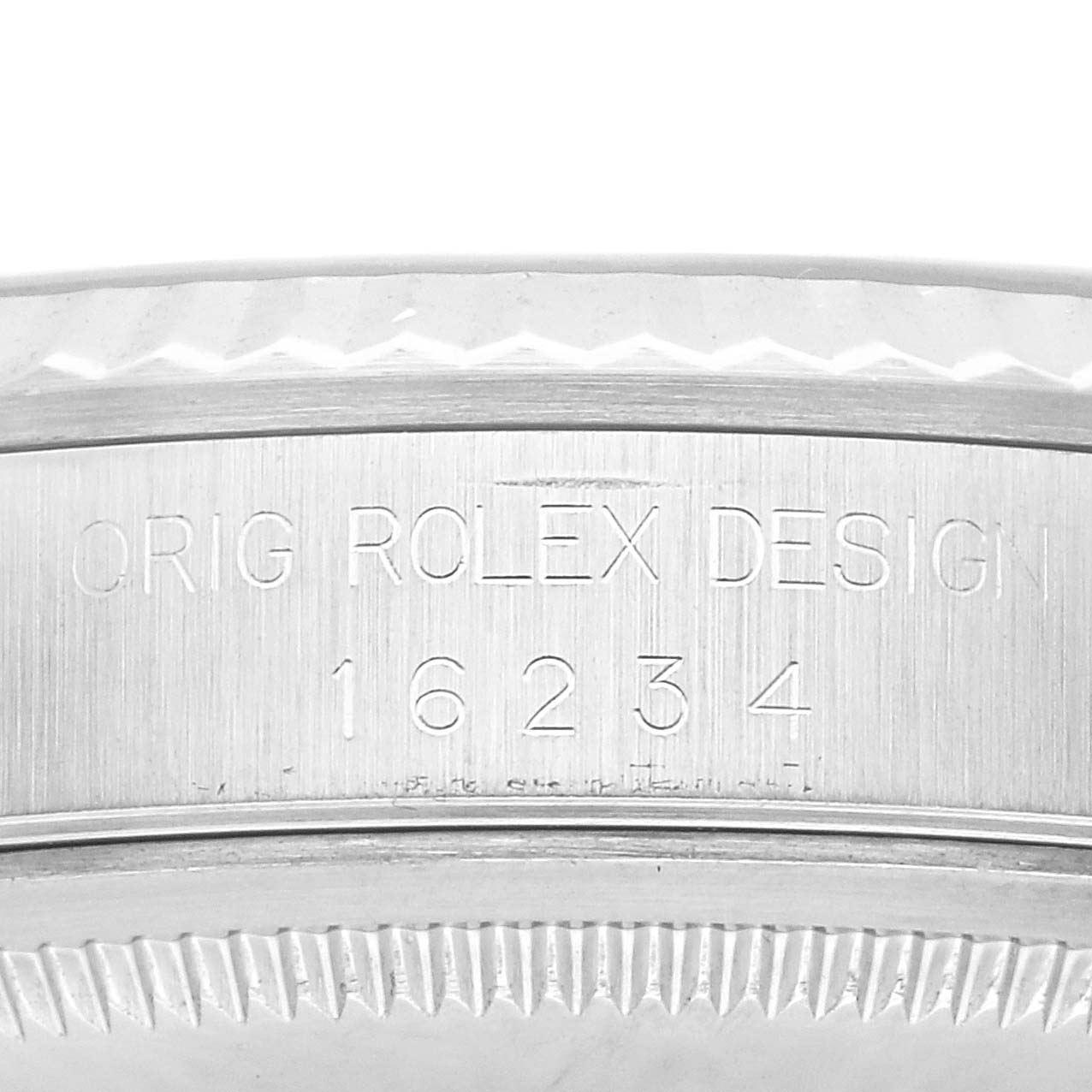 The image shows the side engraving of a Rolex Datejust 16234 Men
s Stainless Steel Silver Dial 16234 Men
s Stainless Steel Silver Dial, featuring "Orig Rolex Design" and model number "16234".