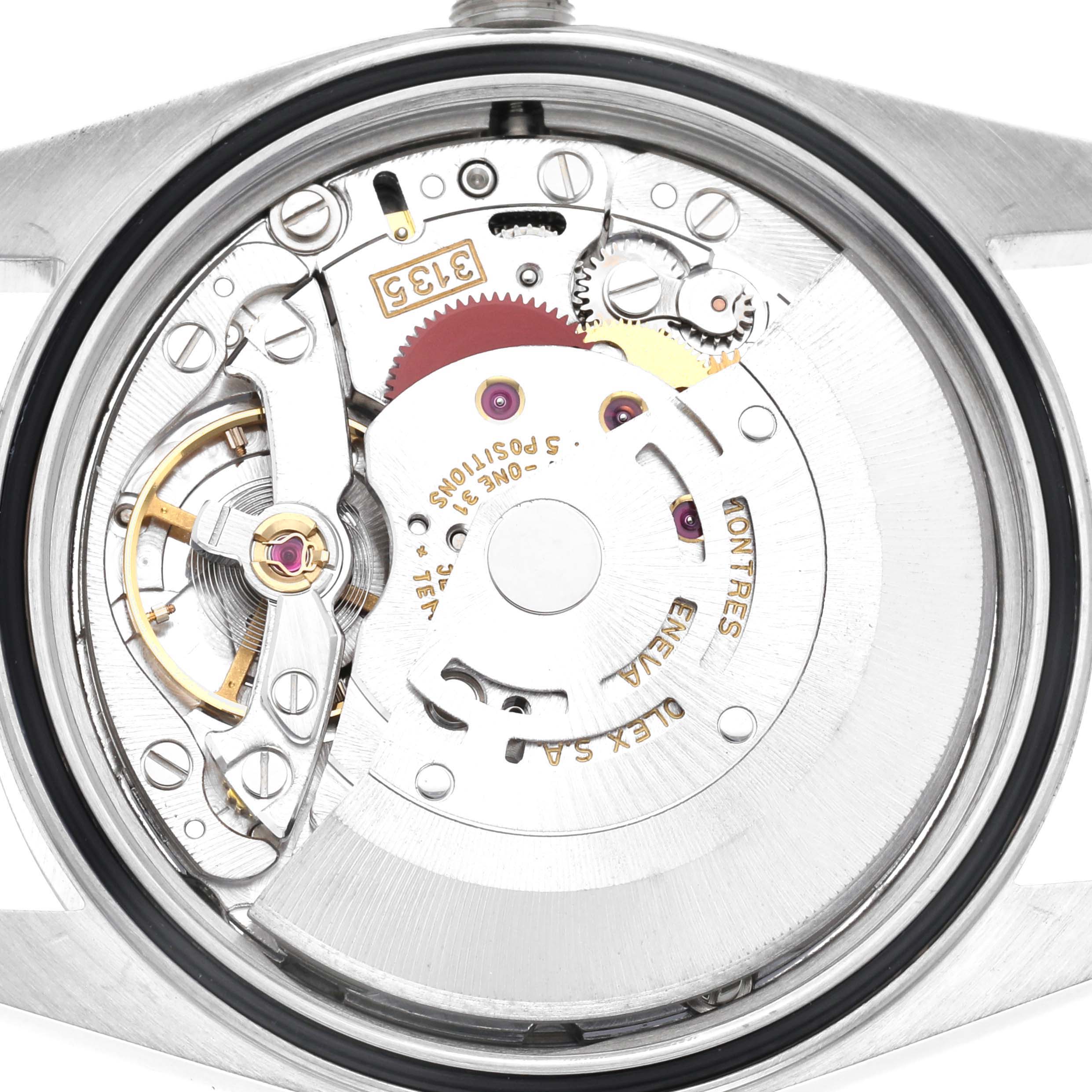 The image shows the movement mechanism of a Rolex Datejust 16234 Men
s Stainless Steel Silver Dial 16234 Men
s Stainless Steel Silver Dial watch from the back, highlighting its intricate gears and components.