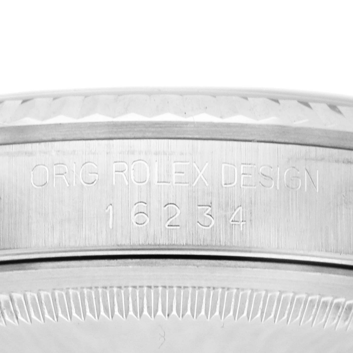 The image shows the side view of the Rolex Datejust 16234 Men
s Stainless Steel Silver Dial 16234 Men
s Stainless Steel Silver Dial bezel and lug with model number engraved.