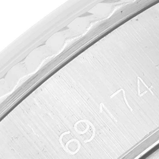 This is a close-up of the Rolex Datejust 69174 Women's Stainless Steel Silver Dial 69174 Women's Stainless Steel Silver Dial model's inner bezel with the model number "69174" engraved.