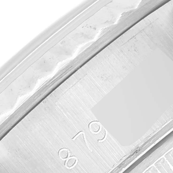 This image shows a close-up of the engraved serial number on the side of a Rolex Datejust 69174 Women's Stainless Steel Silver Dial 69174 Women's Stainless Steel Silver Dial watch.