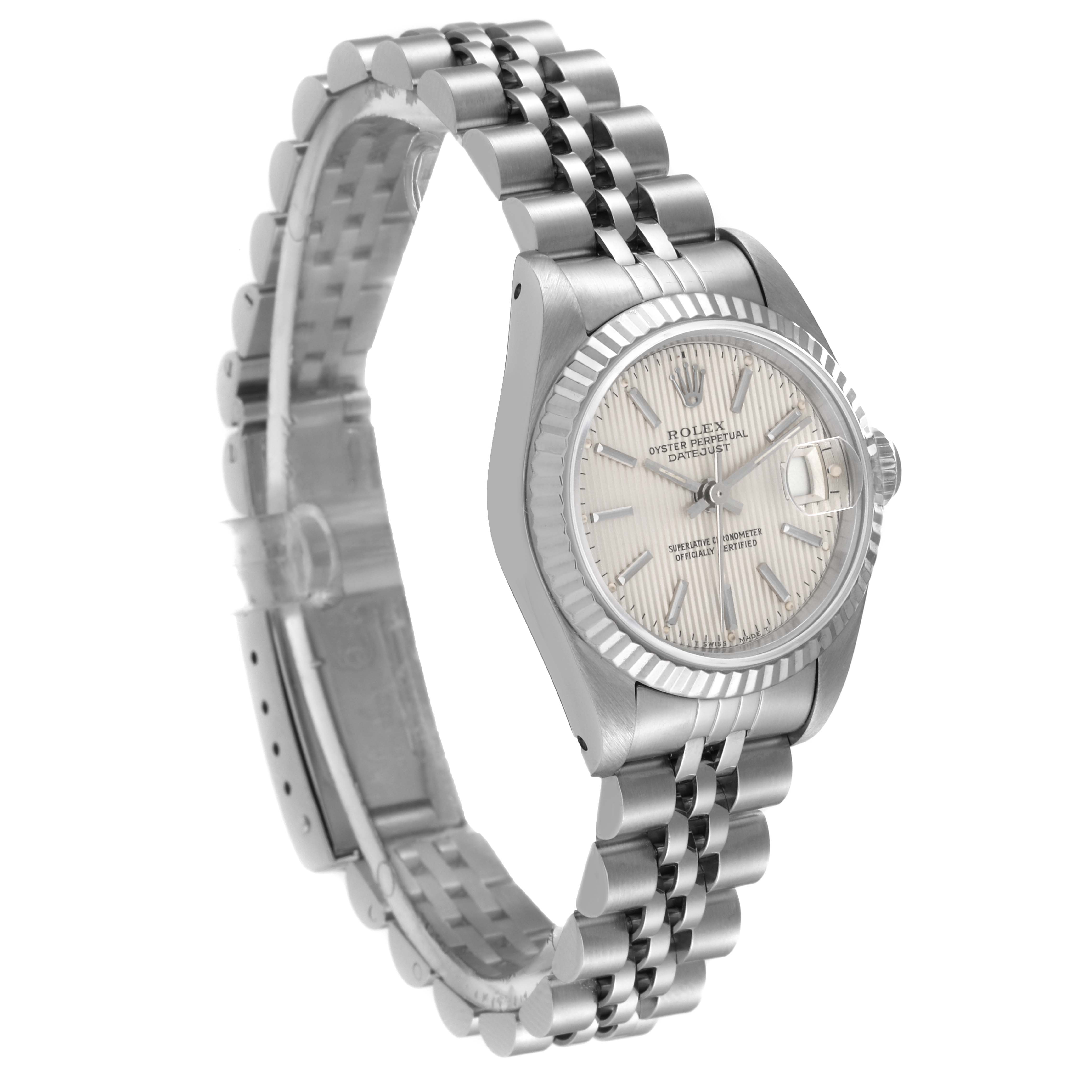 The Rolex Datejust 69174 Women's Stainless Steel Silver Dial 69174 Women's Stainless Steel Silver Dial watch is shown at an angled side view, displaying its face, bezel, and metal bracelet.