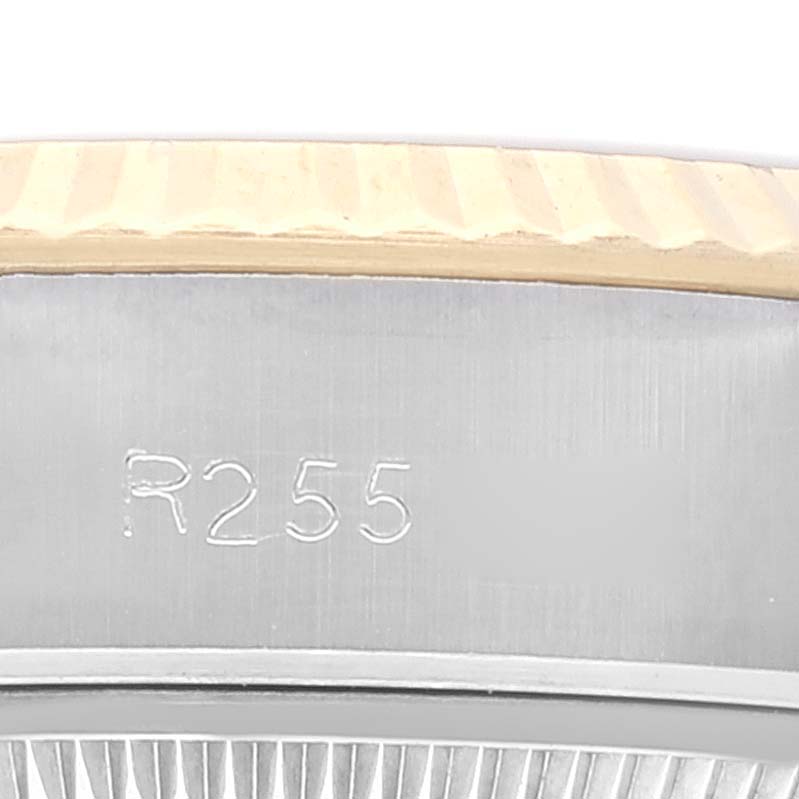 This image shows a close-up view of the case and bezel of the Rolex Datejust 69173 Women's Steel and Gold (two tone) Champagne Dial 69173 Women's Steel and Gold (two tone) Champagne Dial watch, highlighting the engraved model number.
