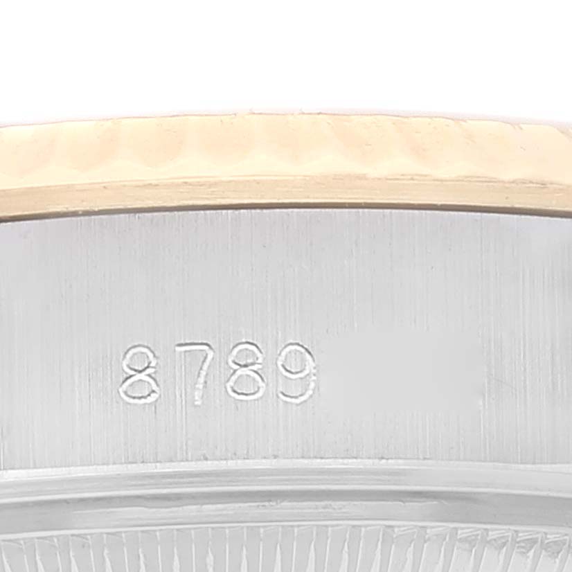 This image shows a close-up of the serial number engraving on the case side of a Rolex Datejust 69173 Women's Steel and Gold (two tone) Champagne Dial 69173 Women's Steel and Gold (two tone) Champagne Dial watch.