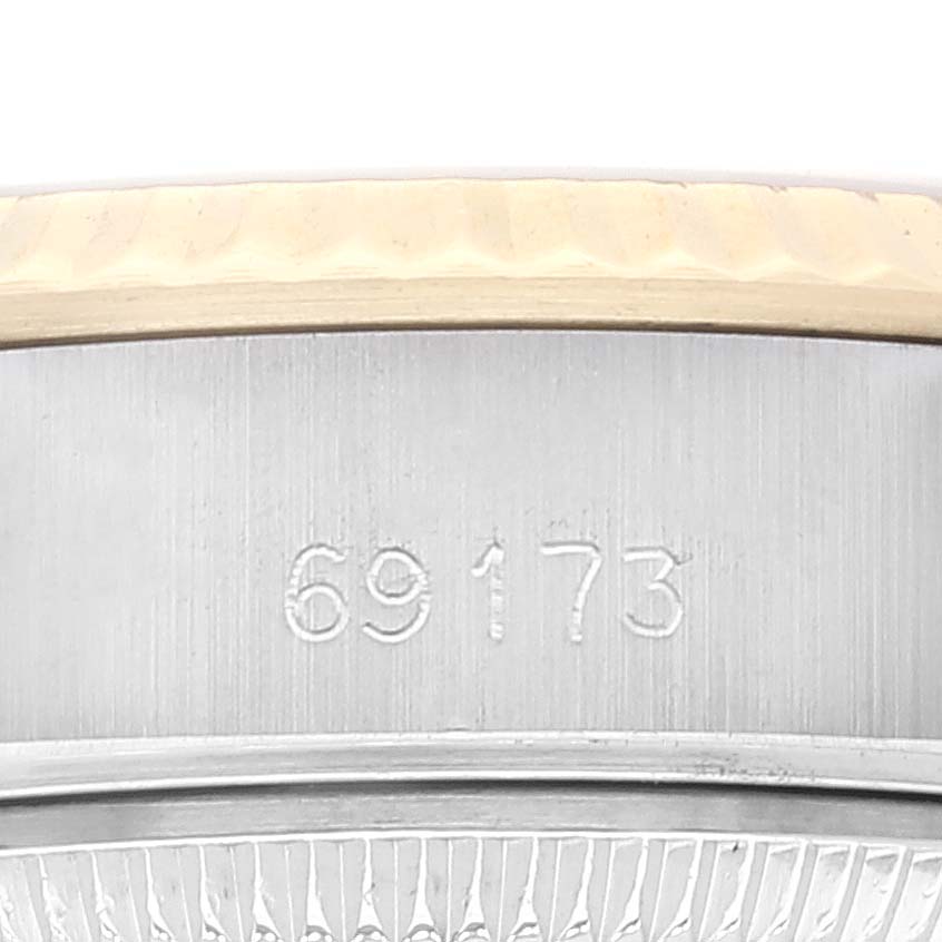 This image shows a close-up of the case side featuring the engraved model number for the Rolex Datejust 69173 Women's Steel and Gold (two tone) Champagne Dial 69173 Women's Steel and Gold (two tone) Champagne Dial watch.