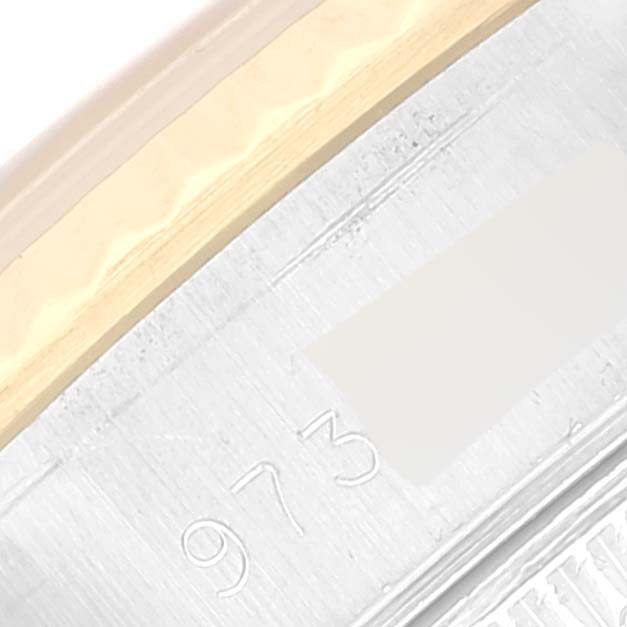 This close-up image shows a detailed view of the bezel and engraved part of the case of a Rolex Datejust 69173 Women's Steel and Gold (two tone) Champagne Dial 69173 Women's Steel and Gold (two tone) Champagne Dial watch.
