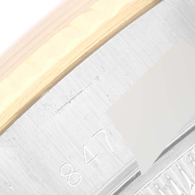 The image shows a close-up view of the side casing of a Rolex Datejust 69173 Women's Steel and Gold (two tone) Champagne Dial 69173 Women's Steel and Gold (two tone) Champagne Dial watch, highlighting the brushed metal finish and engravings.