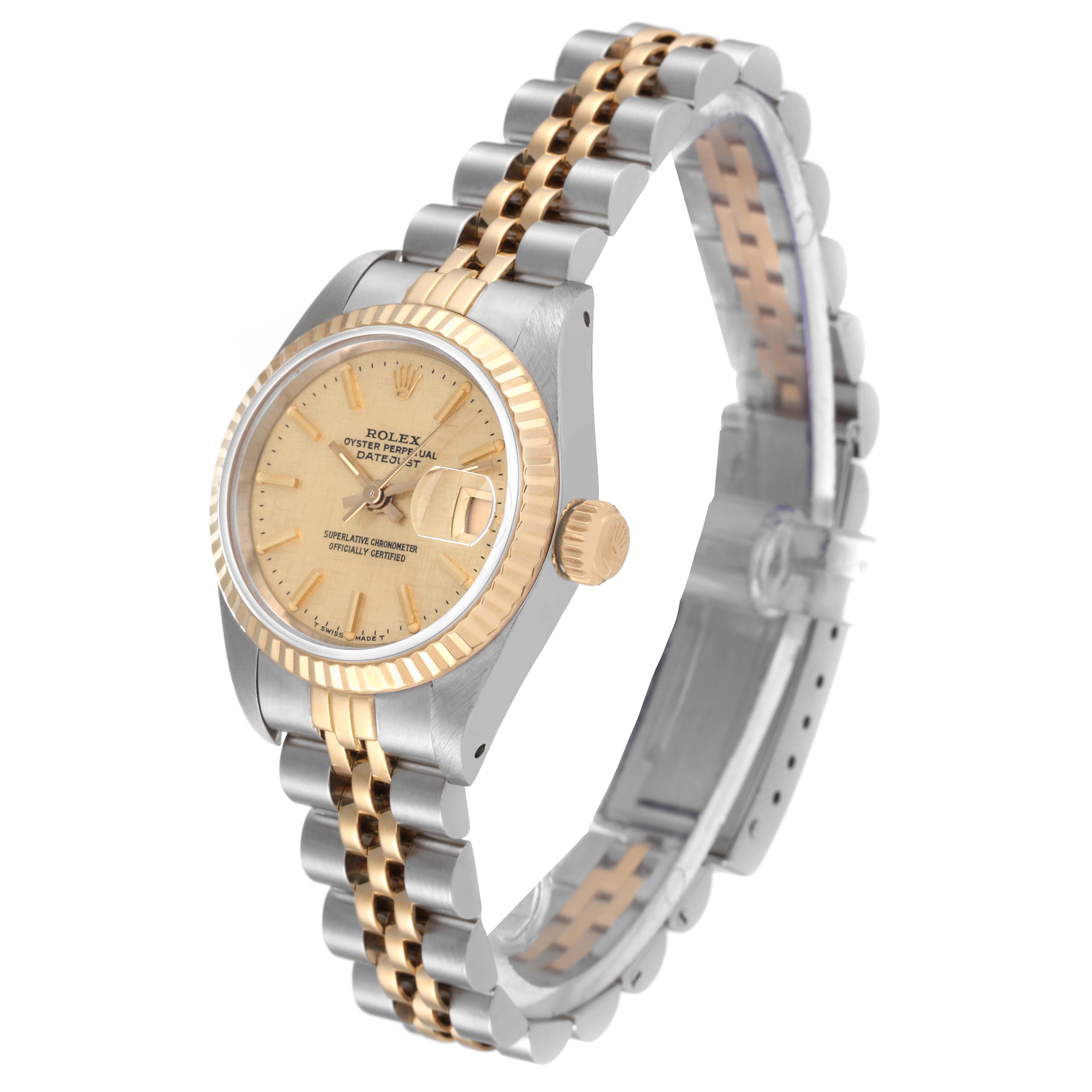 The image shows a Rolex Datejust 69173 Women's Steel and Gold (two tone) Champagne Dial 69173 Women's Steel and Gold (two tone) Champagne Dial watch at an angled view, highlighting the gold bezel, champagne dial, and two-tone oyster bracelet.