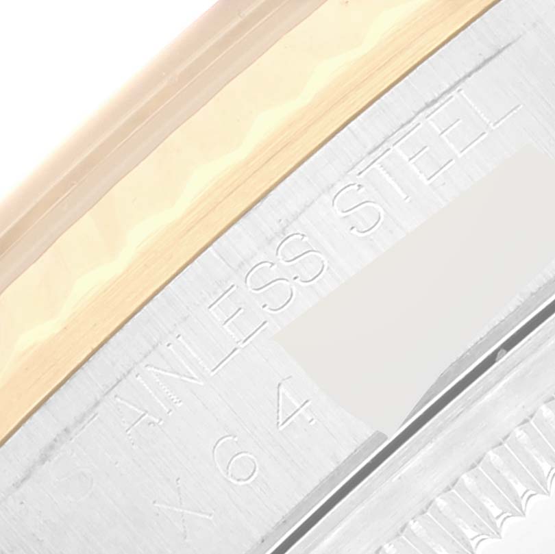 The image shows a close-up of the case edge of a Rolex Datejust 16233 Men's Steel and Gold (two tone) Champagne Dial 16233 Men's Steel and Gold (two tone) Champagne Dial watch, where "STAINLESS STEEL" engraving is visible.