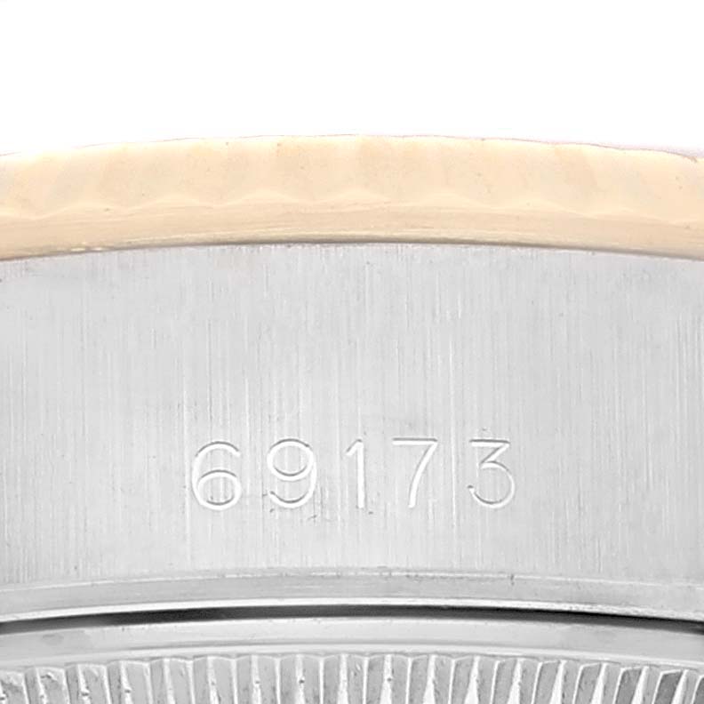 This image shows a close-up of the case side of a Datejust model by Rolex, displaying the model number "69173."