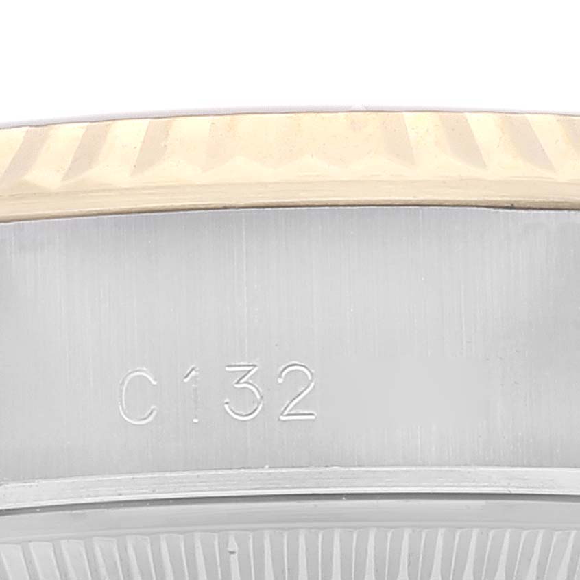 This close-up image shows part of the bezel and case of a Rolex Datejust 69173 Women's Steel and Gold (two tone) Champagne Dial 69173 Women's Steel and Gold (two tone) Champagne Dial watch, displaying the engraving "C132."
