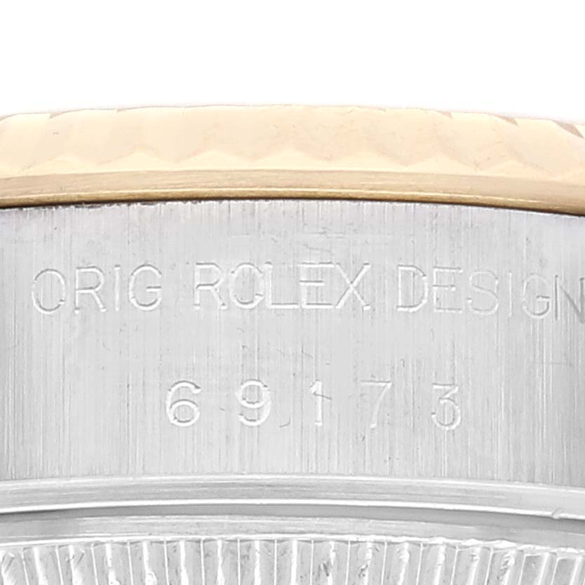 The image shows a close-up of the side of a Rolex Datejust 69173 Women's Steel and Gold (two tone) Champagne Dial 69173 Women's Steel and Gold (two tone) Champagne Dial watch case, with the model number 69173 engraved.