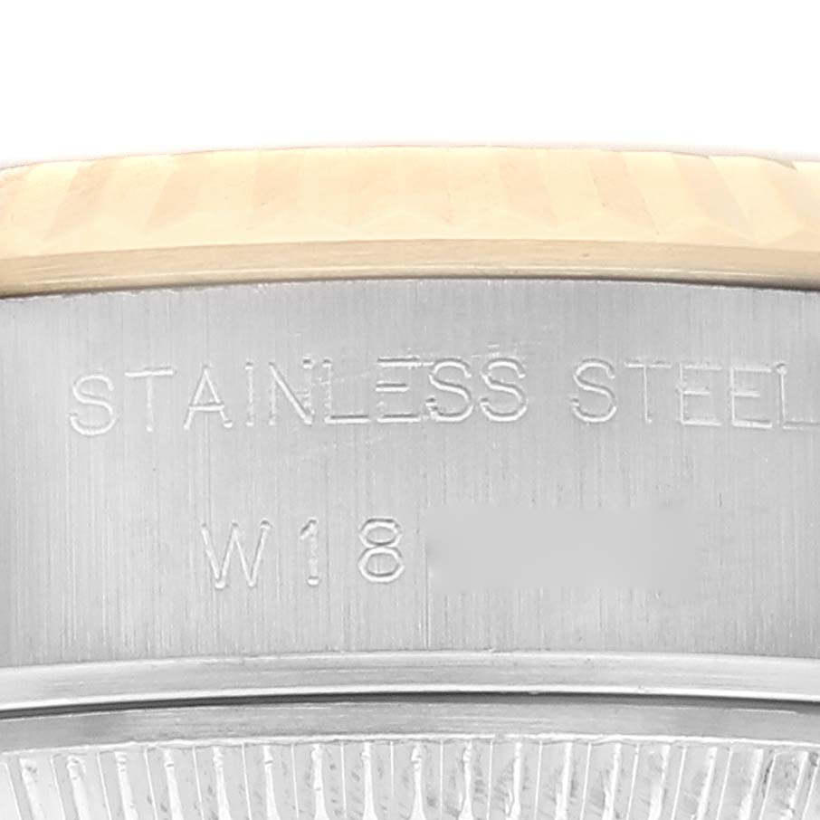 The image shows a close-up of the side of a Rolex Datejust 69173 Women's Steel and Gold (two tone) Champagne Dial 69173 Women's Steel and Gold (two tone) Champagne Dial watch, highlighting the stainless steel engraving.