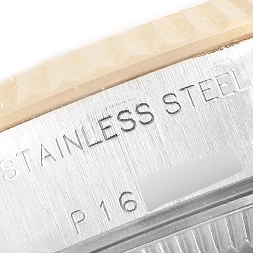 The image shows a close-up of the stainless steel rim and part of the serial number of a Rolex Datejust 79173 Women
s Steel and Gold (two tone) Mother of Pearl Dial 79173 Women
s Steel and Gold (two tone) Mother of Pearl Dial watch.