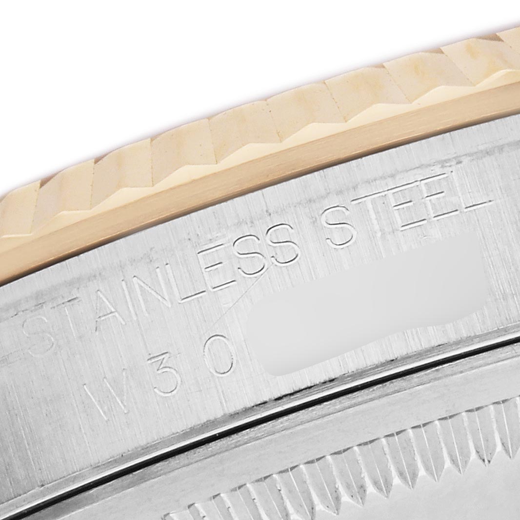 The image shows a close-up of the bezel and engraved side of a Rolex Datejust 16233 Men
s Steel and Gold (two tone) Mother of Pearl Dial 16233 Men
s Steel and Gold (two tone) Mother of Pearl Dial, highlighting "STAINLESS STEEL" text.