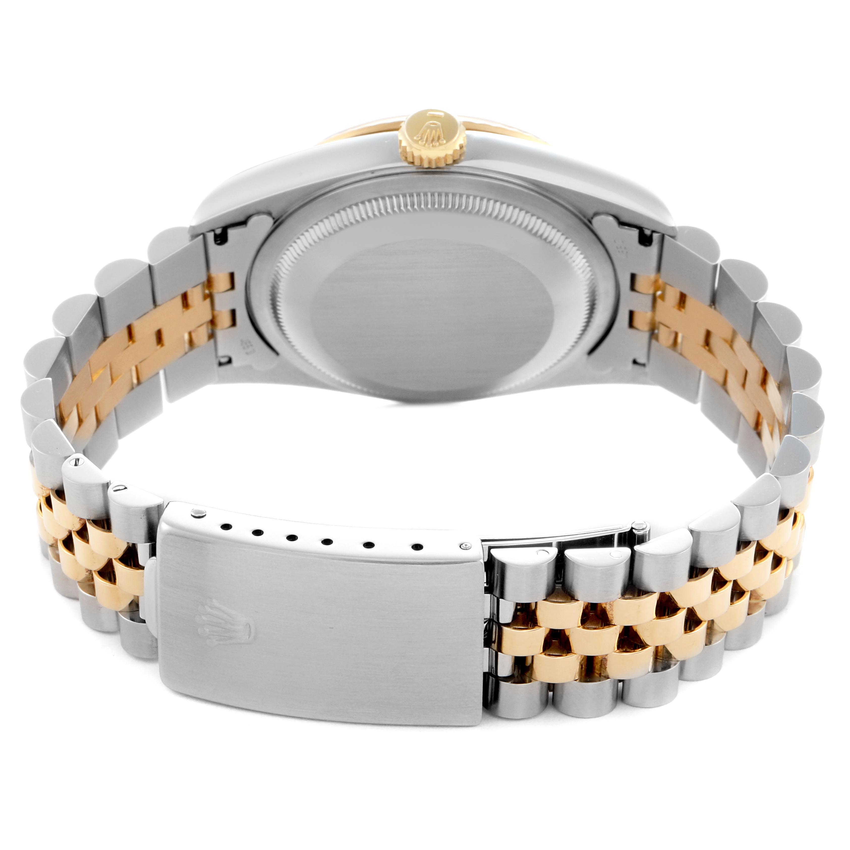 The image shows the back view of a Rolex Datejust 16233 Men
s Steel and Gold (two tone) Mother of Pearl Dial 16233 Men
s Steel and Gold (two tone) Mother of Pearl Dial, highlighting the two-tone bracelet and clasp.