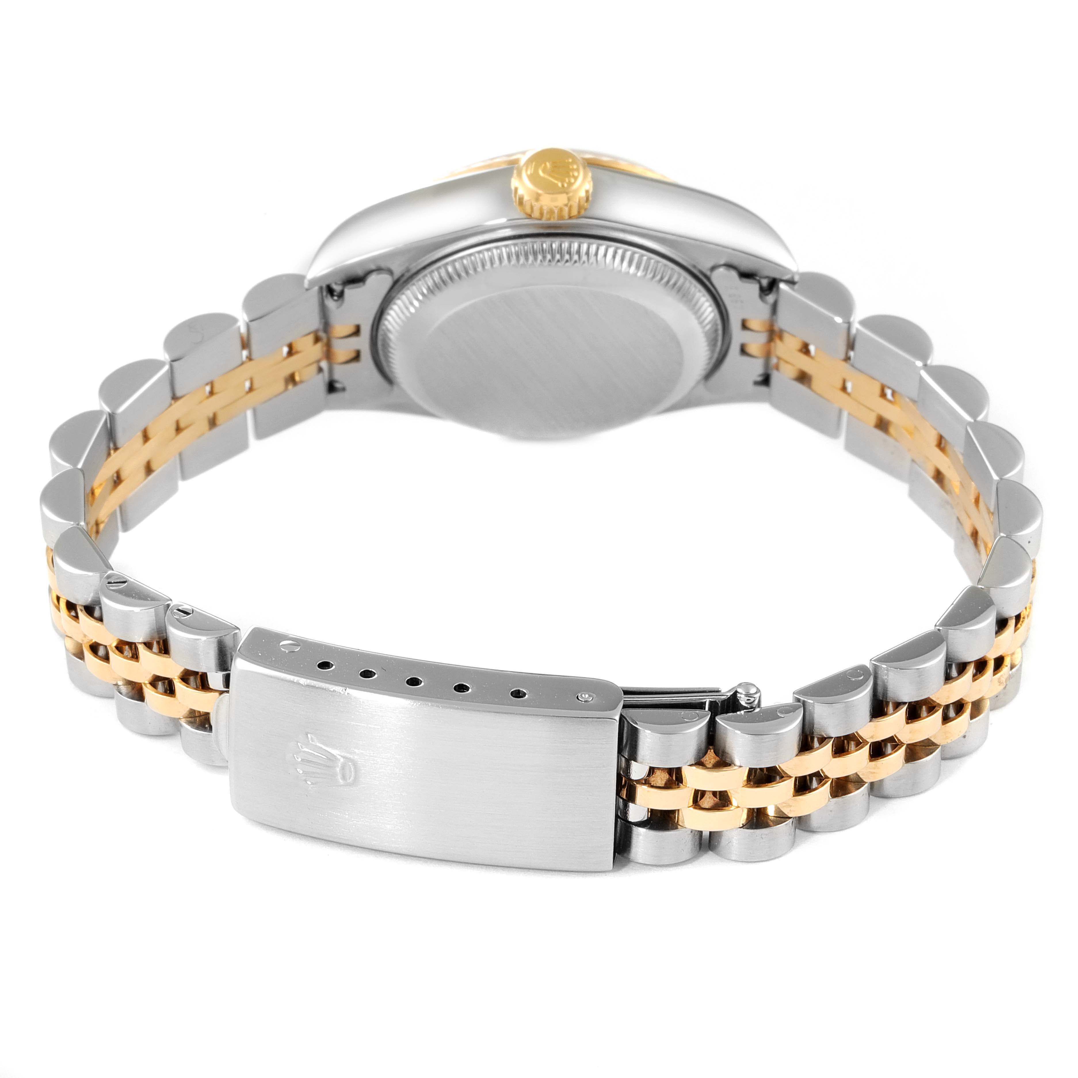The image shows the rear view of a Rolex Datejust 79173 Women
s Steel and Gold (two tone) Grey Dial 79173 Women
s Steel and Gold (two tone) Grey Dial watch, highlighting its two-tone bracelet and case back.