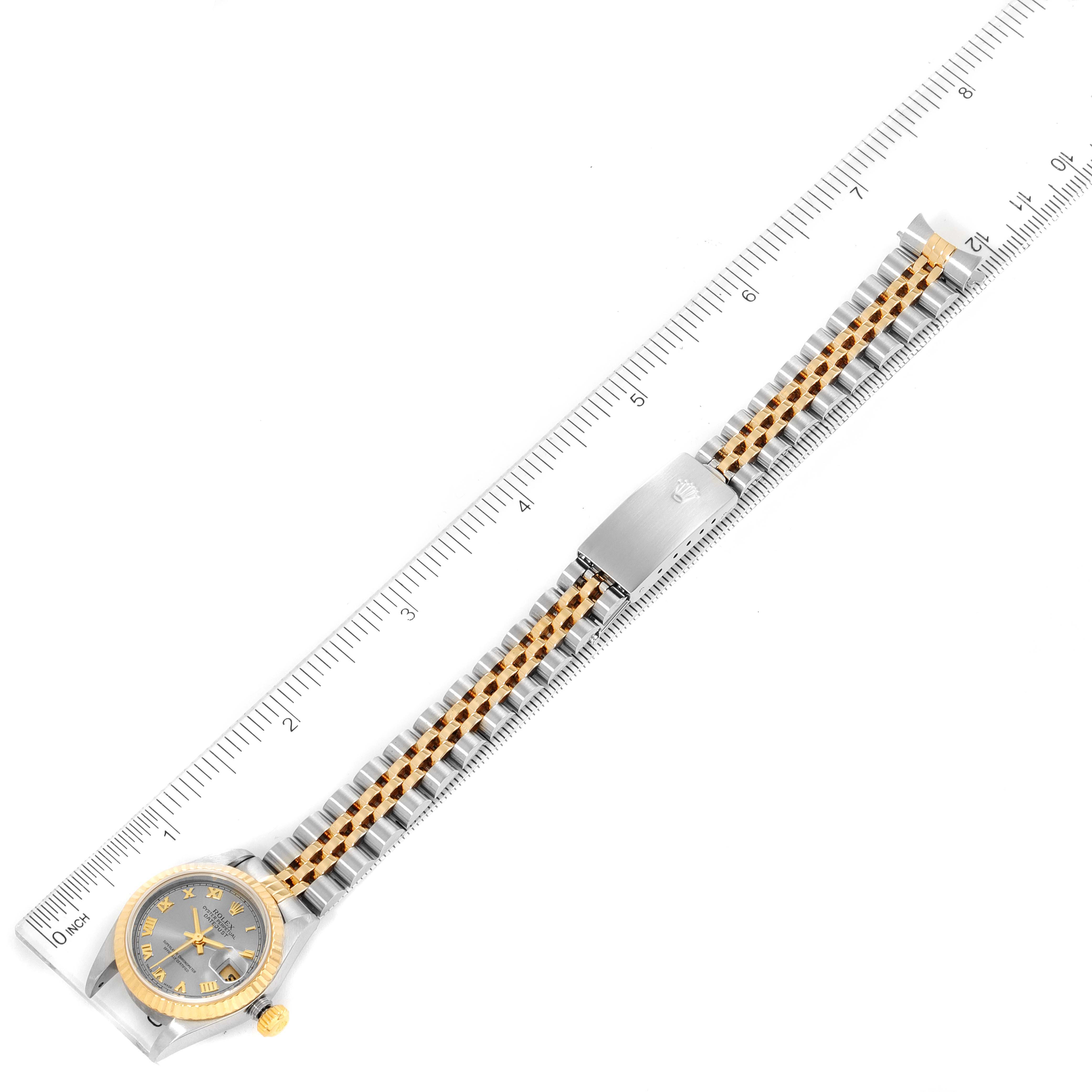 The image shows a Rolex Datejust 79173 Women
s Steel and Gold (two tone) Grey Dial 79173 Women
s Steel and Gold (two tone) Grey Dial model watch from a top-down angle, displaying the face, bezel, and full bracelet.