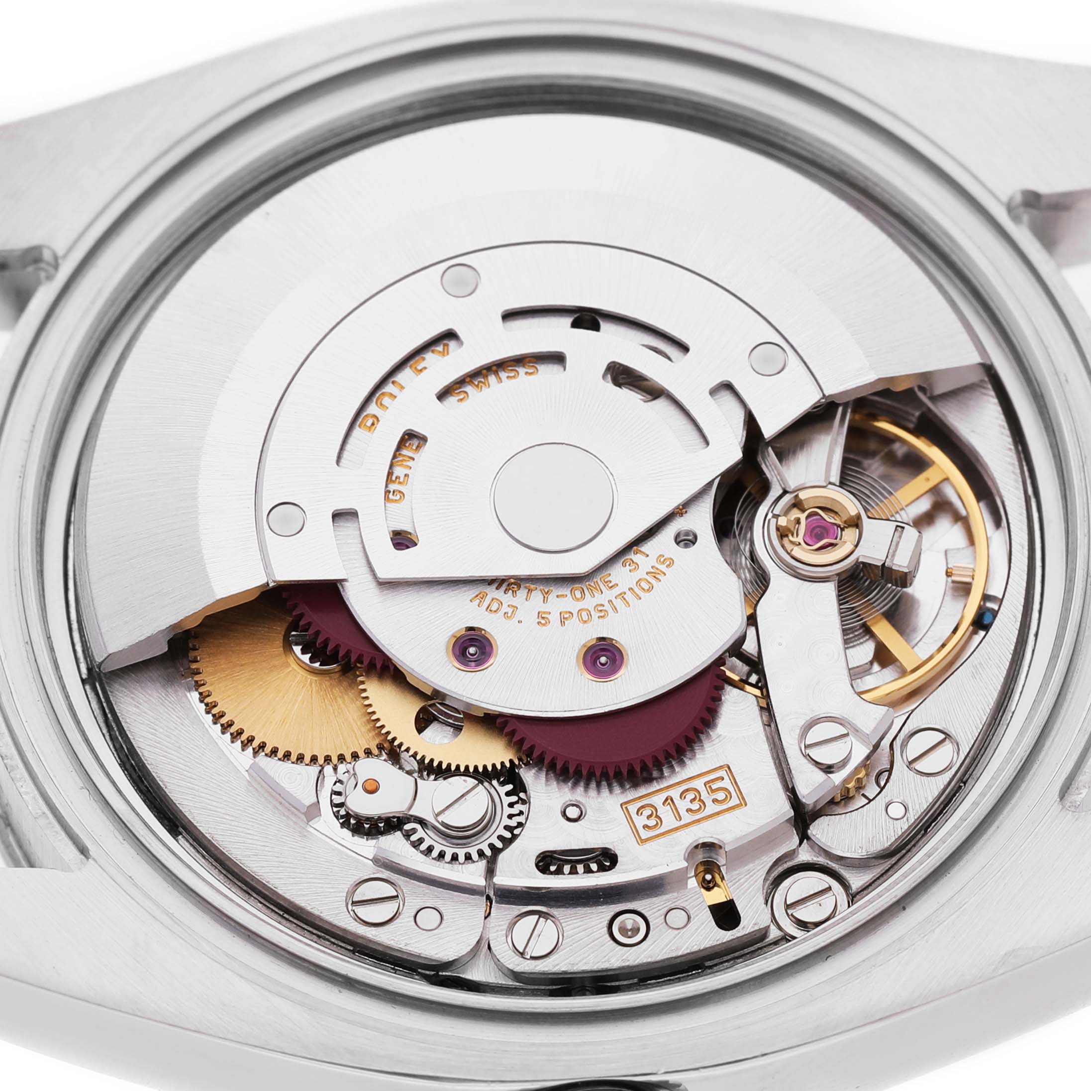 The image shows the inner mechanism of a Rolex Turn-o-Graph 116264 Men's Stainless Steel Blue Dial watch, showcasing its intricate gears and movement parts.