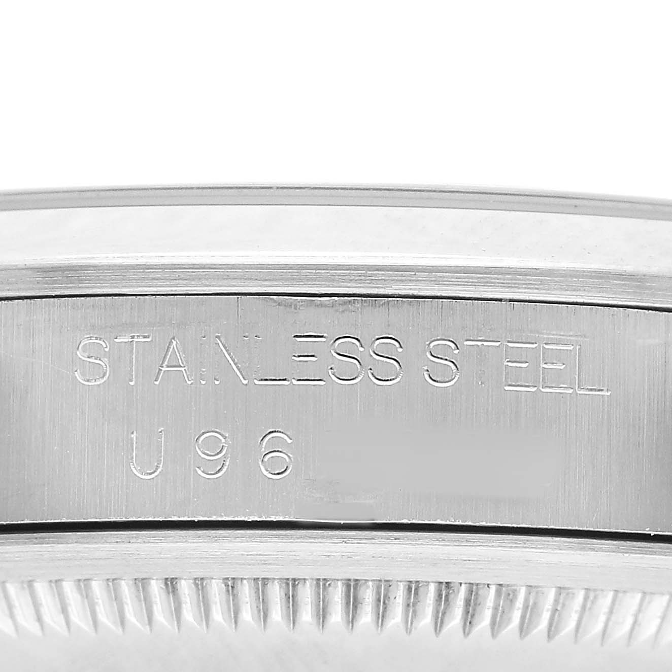 The image shows a close-up of the side of a Rolex Explorer 14270 Men's Stainless Steel Black Dial, highlighting the engraved text "STAINLESS STEEL."