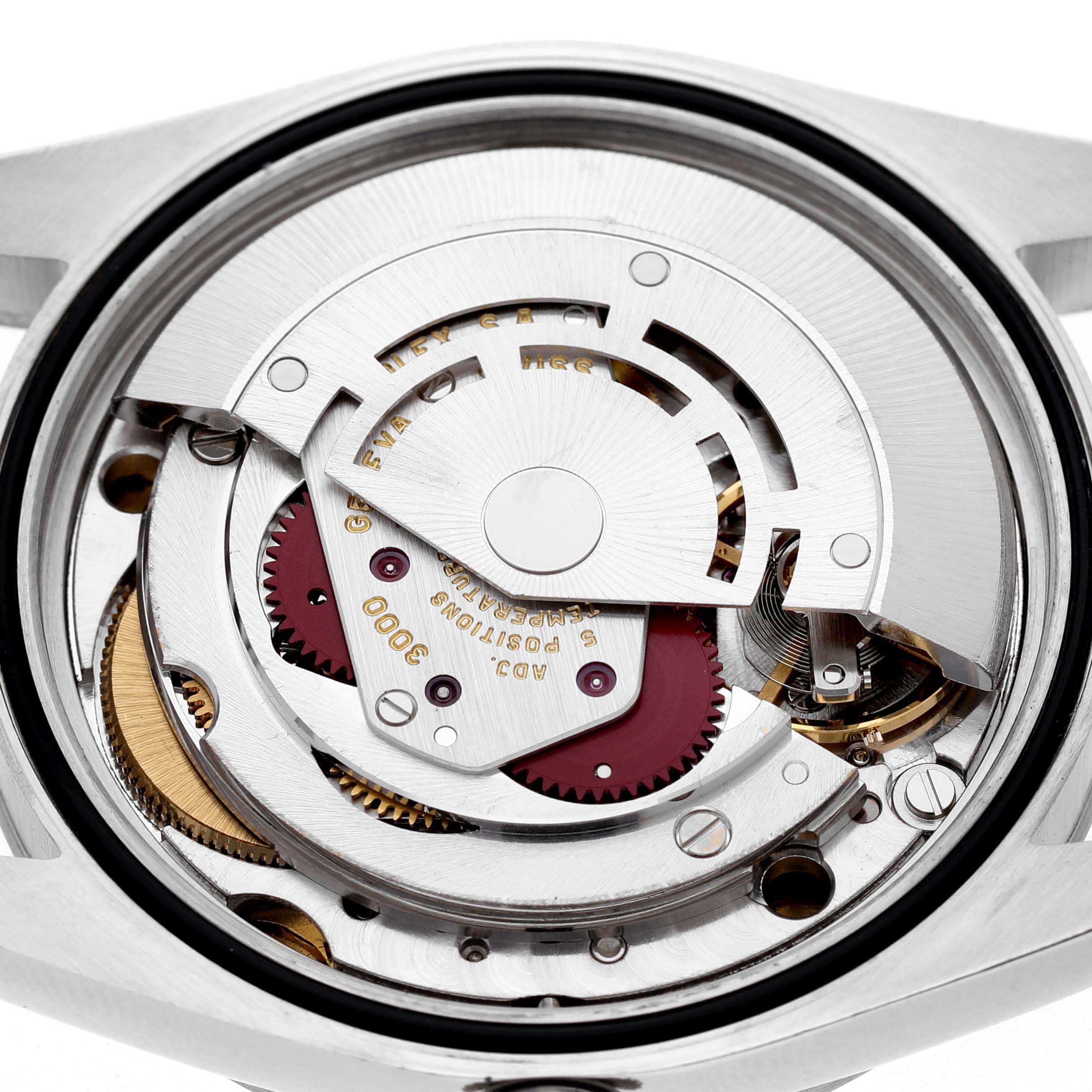 The image shows the movement of a Rolex Explorer 14270 Men's Stainless Steel Black Dial watch viewed from the back, highlighting gears and components.