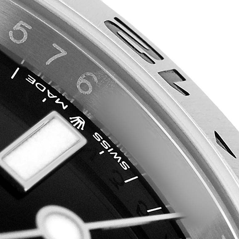 The image shows a close-up of the bezel and dial edge of a Rolex Explorer 226570 Men's Stainless Steel Black Dial watch, focusing on markers and text.