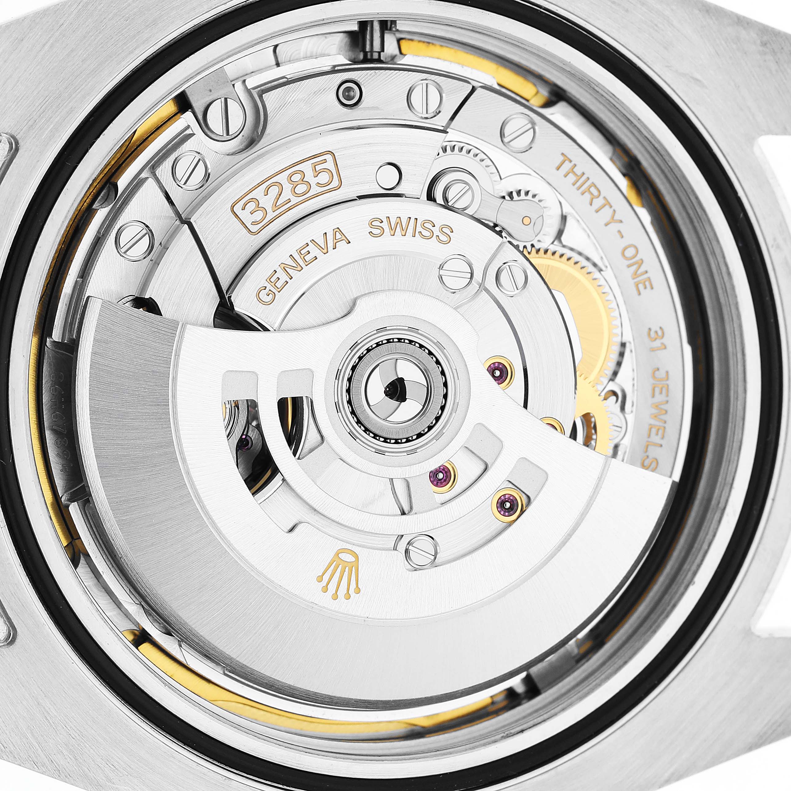 The image shows the movement of the Rolex Explorer 226570 Men's Stainless Steel Black Dial watch, highlighting its intricate gears and the self-winding rotor.