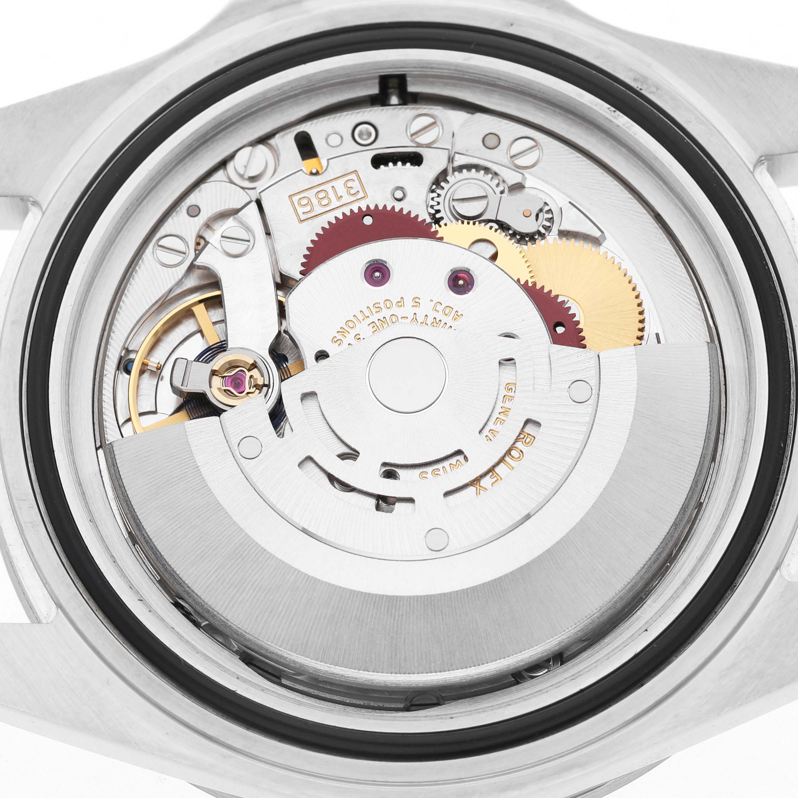 The image shows the movement mechanism of a Rolex Explorer 16570 T Men's Stainless Steel Black Dial watch from a back angle, displaying the gears and balance wheel.