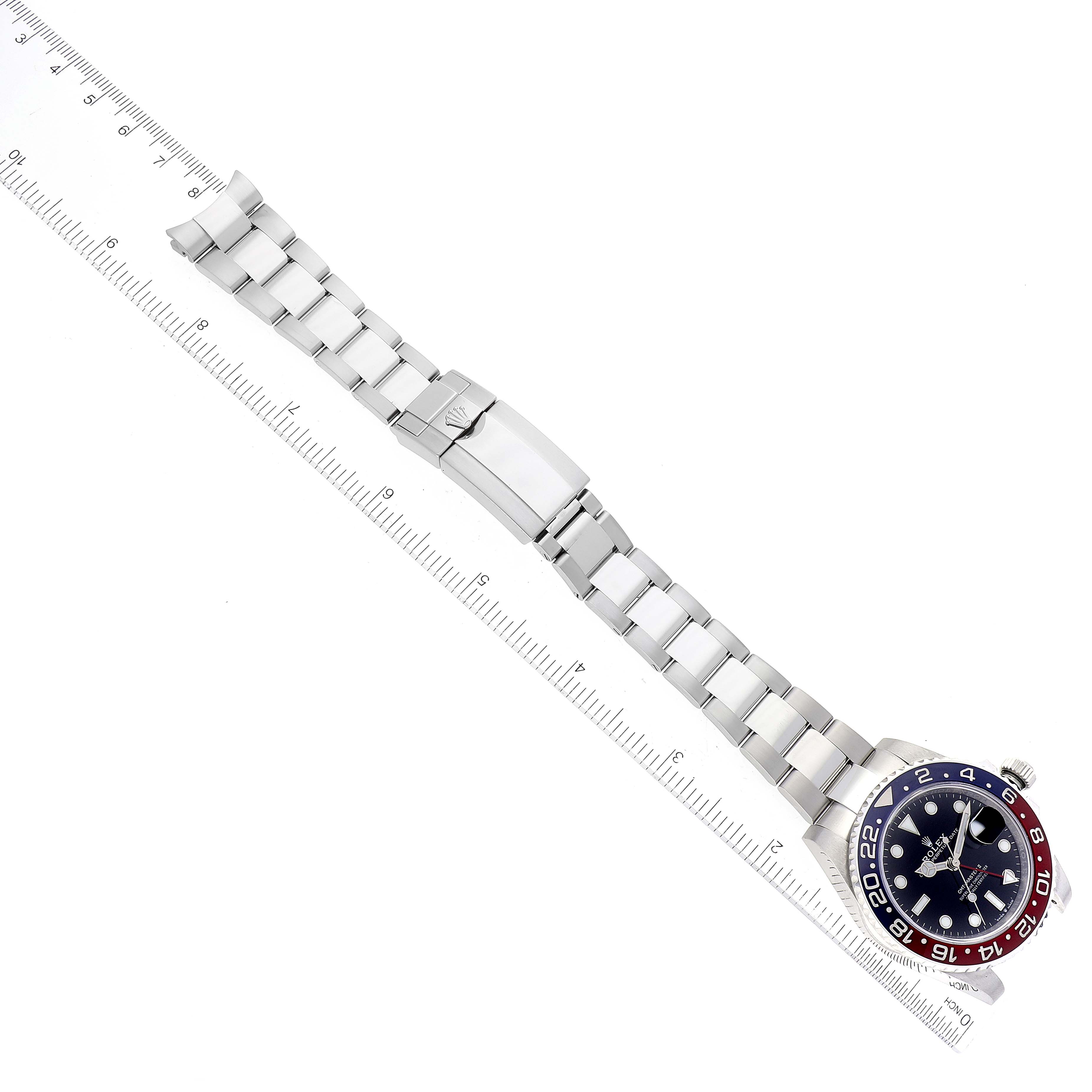 The image shows a top-down view of a Rolex GMT-Master 126710 Men
s Stainless Steel Black Dial 126710 Men
s Stainless Steel Black Dial watch, featuring its full bracelet, clasp, and bezel.
