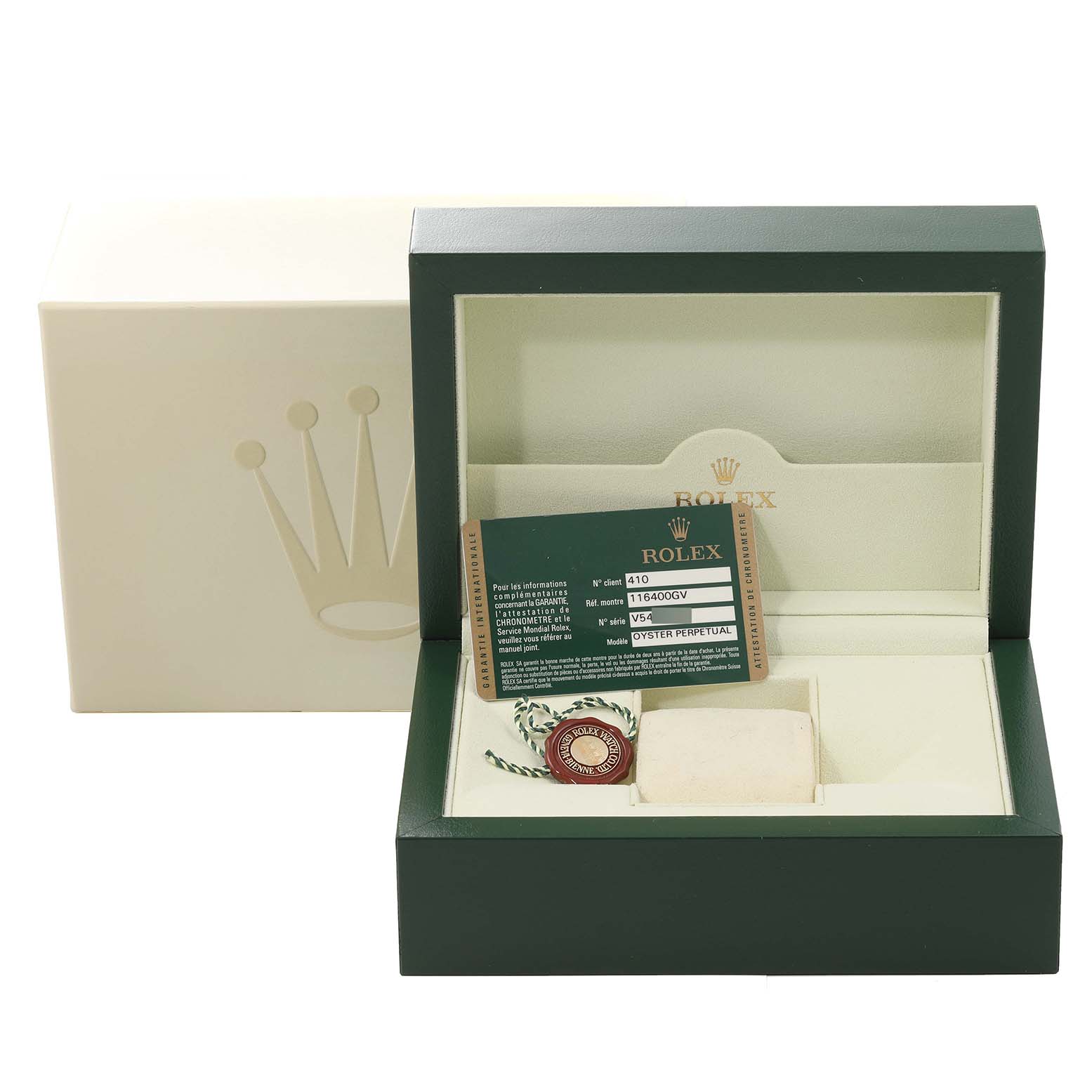 The image shows the box and accessories of a Rolex Milgauss 116400 Men's Stainless Steel Black Dial 116400 Men's Stainless Steel Black Dial watch, including warranty card and tag, from a front angle.