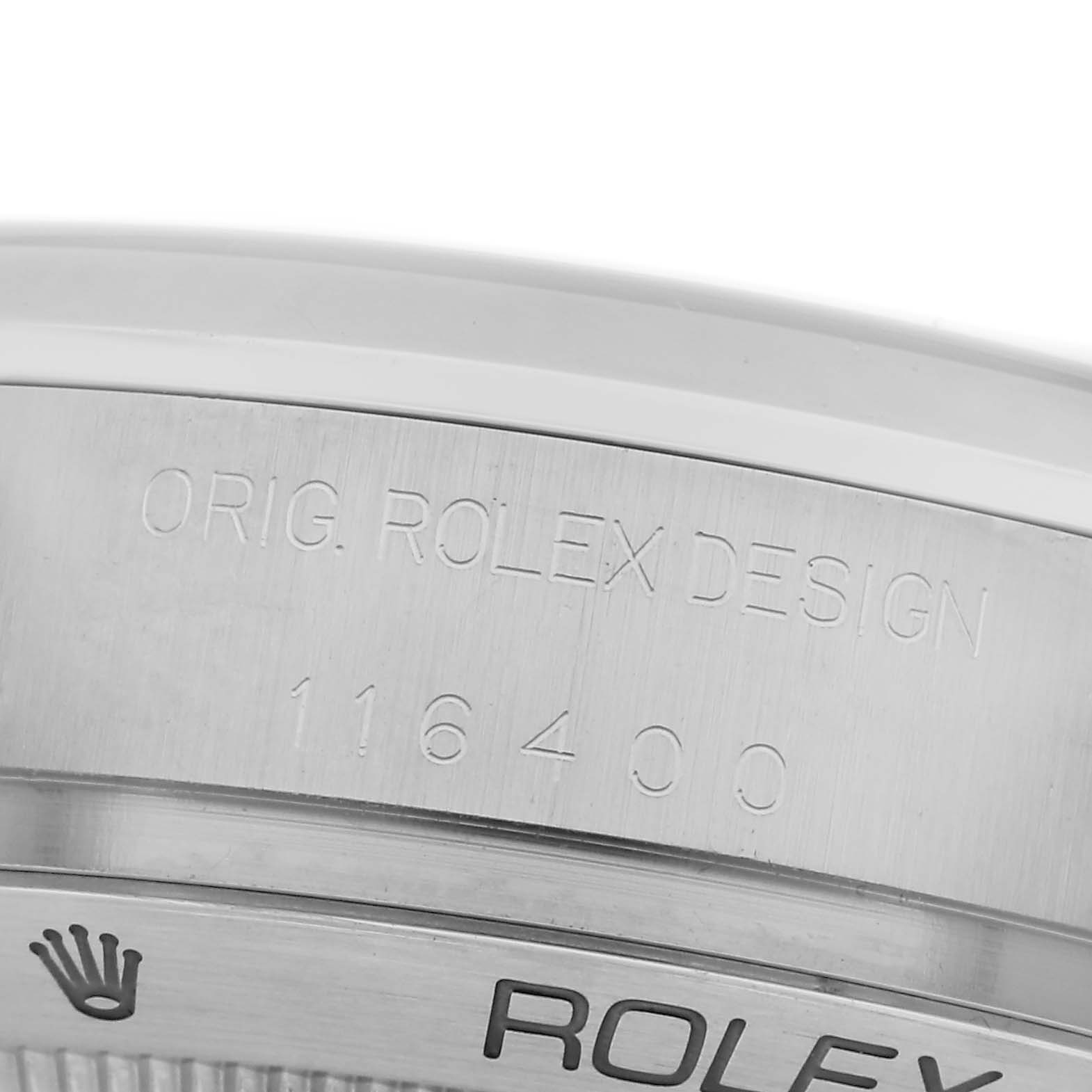 The image shows a close-up of the Milgauss model by Rolex, focusing on the engraved side of the case.