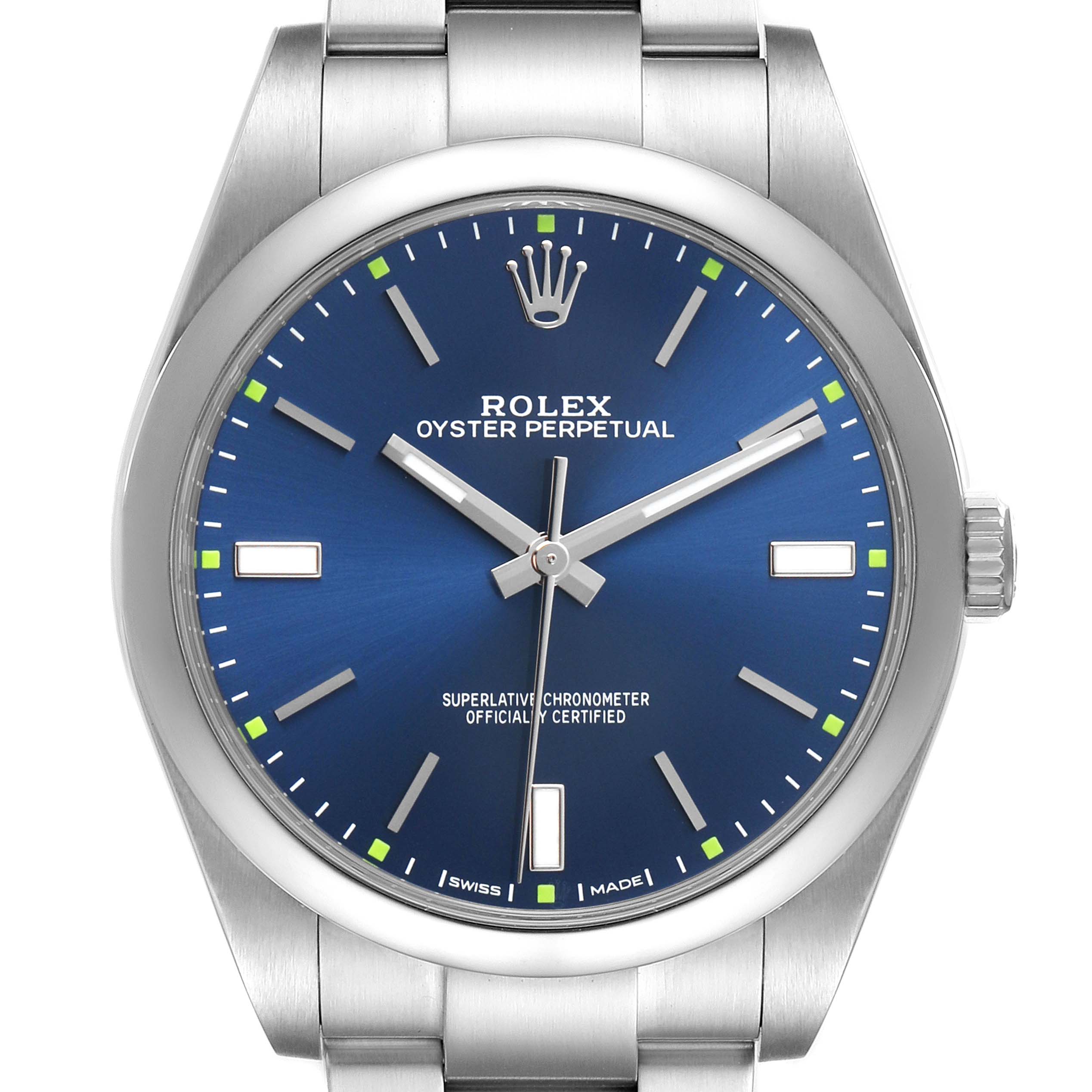 The image shows a front view of a Rolex Oyster Perpetual 114300 Men's Stainless Steel Blue Dial watch, highlighting its blue dial, hands, indices, and stainless steel case.