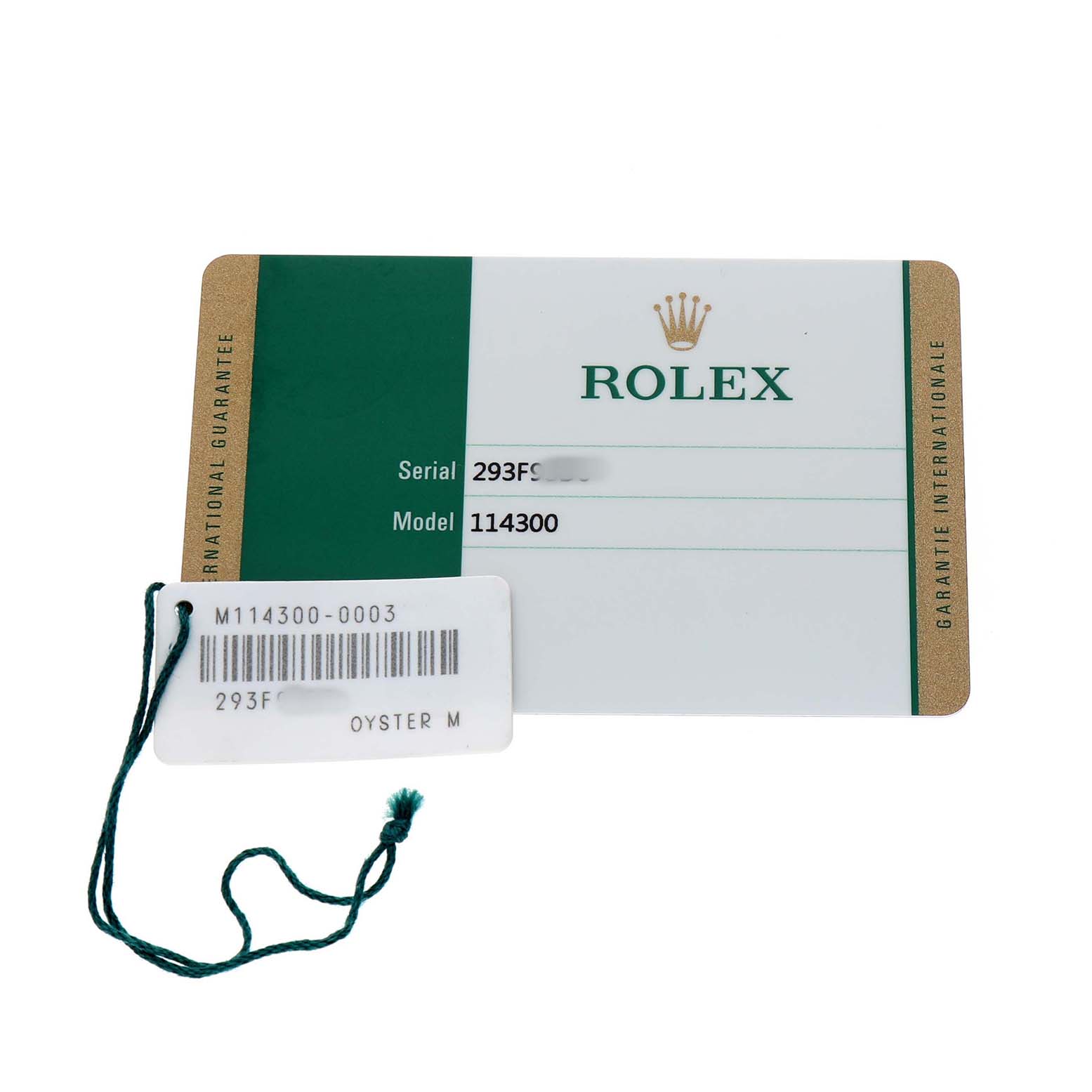 The image shows a Rolex Oyster Perpetual 114300 Men's Stainless Steel Blue Dial warranty card and a tag with model details.