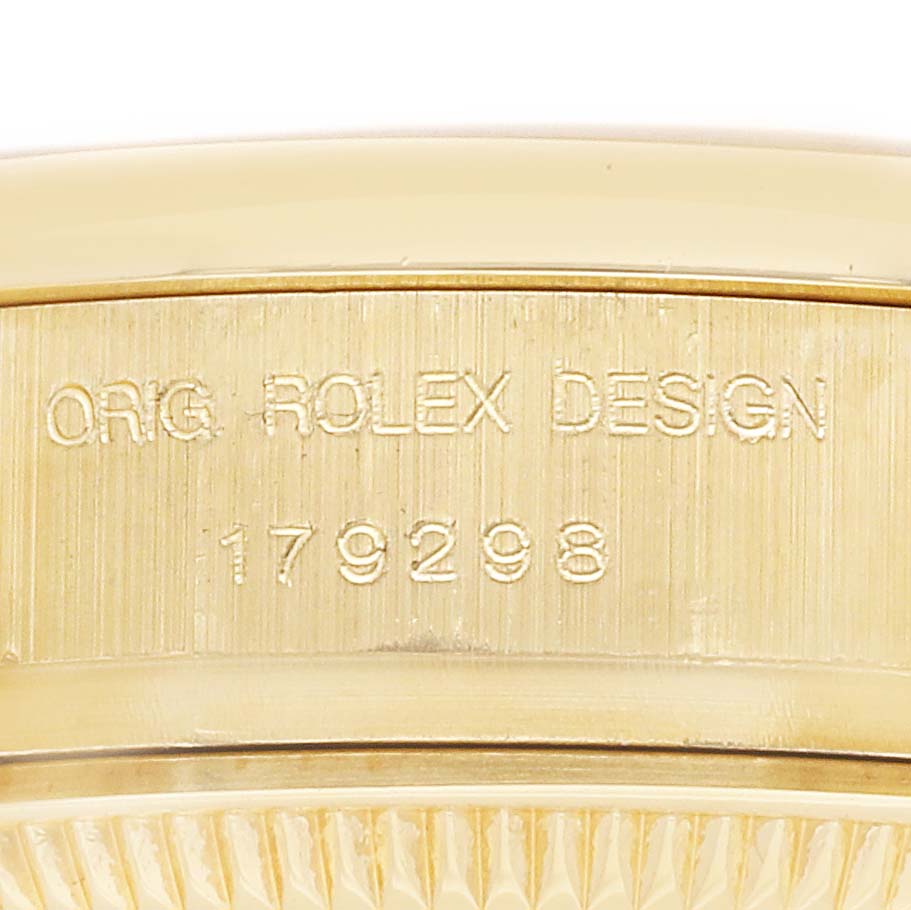The image shows a close-up of the case side of a Rolex President 179298 Women
s Yellow Gold Mother of Pearl Dial 179298 Women
s Yellow Gold Mother of Pearl Dial watch, with the model number engraved.