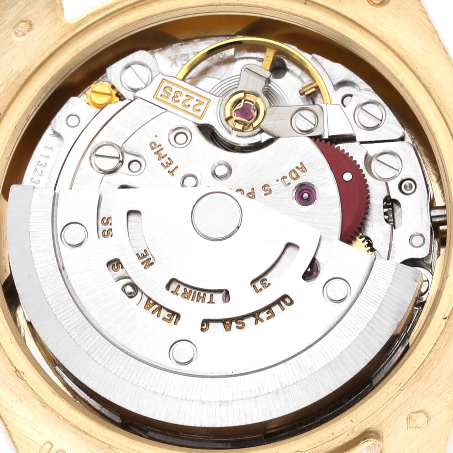 The image shows the movement of a Rolex President 179298 Women
s Yellow Gold Mother of Pearl Dial 179298 Women
s Yellow Gold Mother of Pearl Dial watch from a top-down angle, highlighting the rotor, gears, and intricate mechanics.