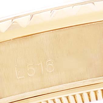 The image shows a close-up of the case and part of the bezel of a Rolex President 69188 Women's Yellow Gold Champagne Dial 69188 Women's Yellow Gold Champagne Dial model watch, highlighting the serial number.