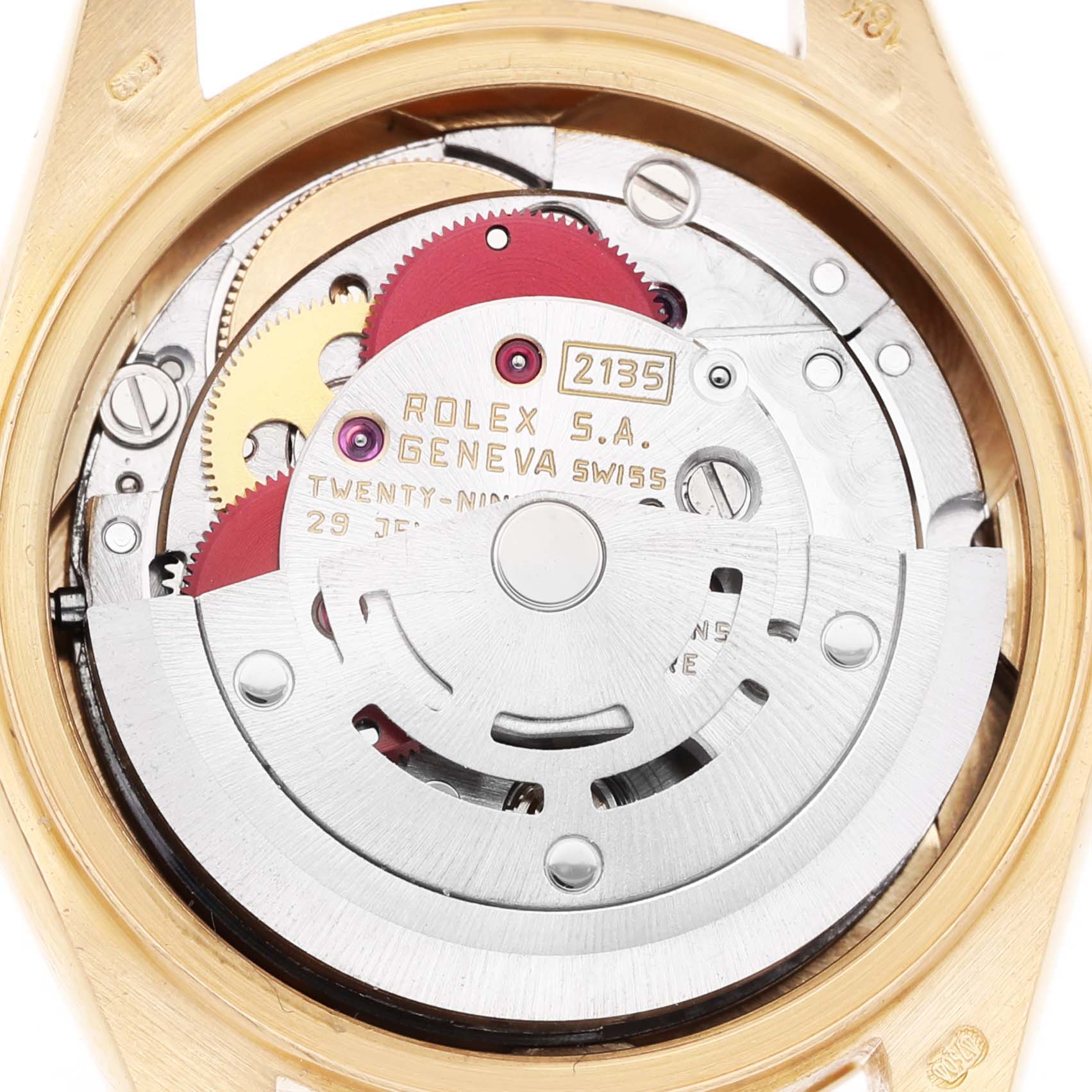 The image shows the movement of a Rolex President 69178 Women's Yellow Gold Silver Dial watch, showcasing its gears and rotor from the back.