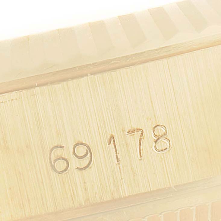 The image shows a close-up view of the model number engraving on the side of a Rolex President 69178 Women
s Yellow Gold White Dial 69178 Women
s Yellow Gold White Dial watch case.