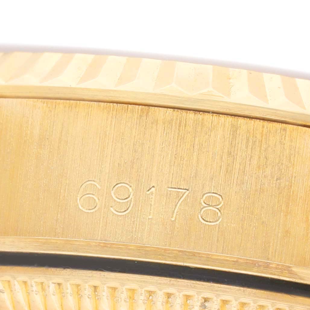The image shows a close-up of the case side of a Rolex President 69178 Women's Yellow Gold Champagne Dial watch with the model number 69178 engraved.