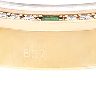 This close-up image shows the side of the case and bezel of a Rolex President 69078 Women's Yellow Gold Champagne Dial 69078 Women's Yellow Gold Champagne Dial model watch, featuring a gold band with diamond and emerald accents.
