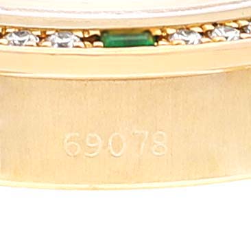 This image shows the side of the Rolex President 69078 Women's Yellow Gold Champagne Dial 69078 Women's Yellow Gold Champagne Dial model 69078, highlighting the model number and part of the bezel with gemstones.