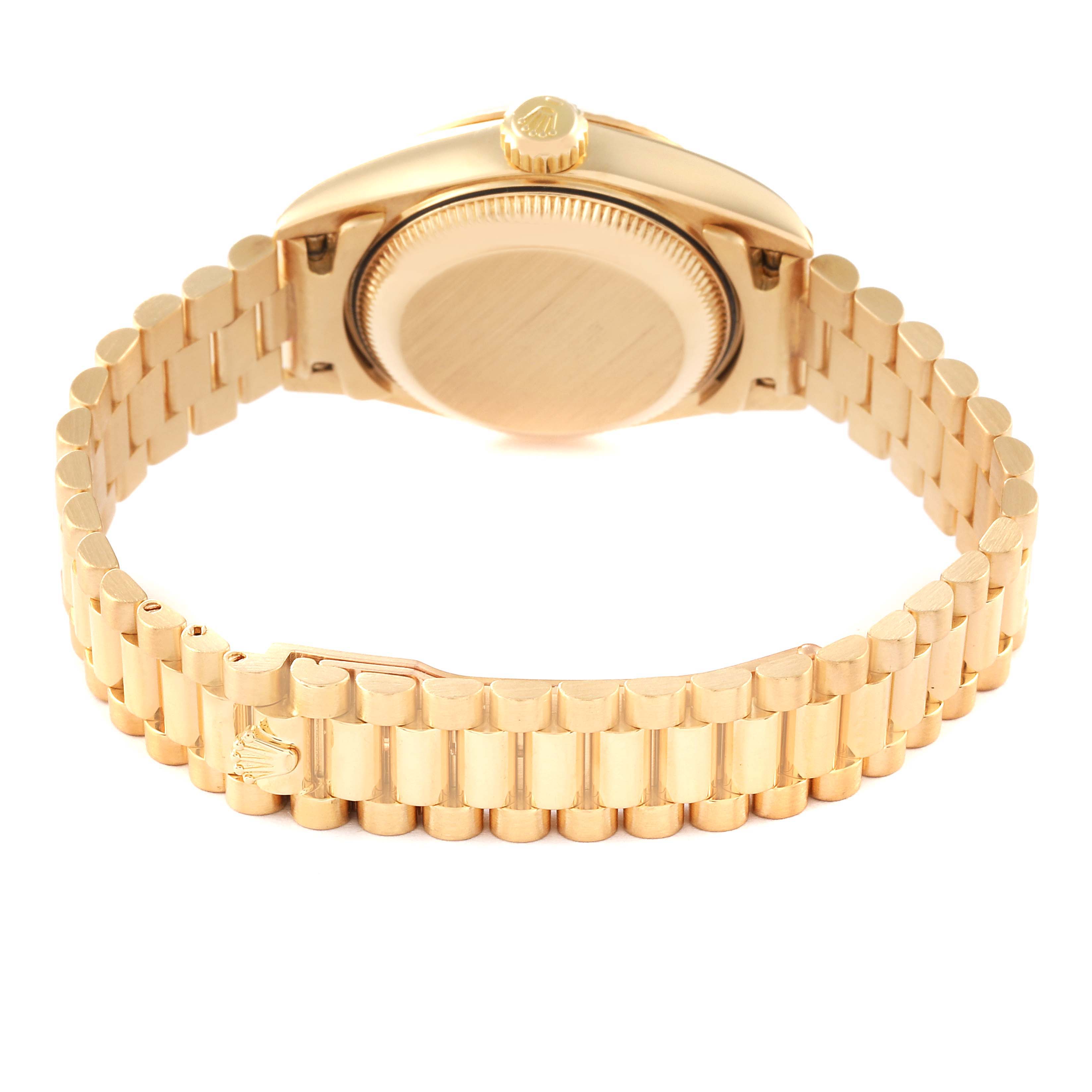 The image shows the back view of a Rolex President 79178 Women's Yellow Gold Black Dial 79178 Women's Yellow Gold Black Dial model watch, highlighting its gold case, crown, and bracelet.