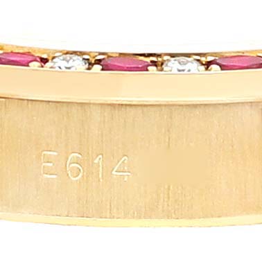 This image shows a close-up of the Rolex President 69198 Women's Yellow Gold  69198 Women's Yellow Gold  watch band with visible gems and an engraved serial number.